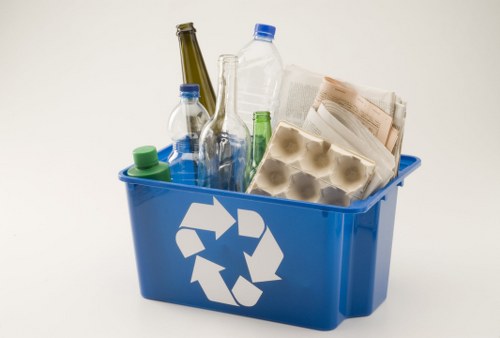 Workers and waste removal equipment representing ethical labour standards