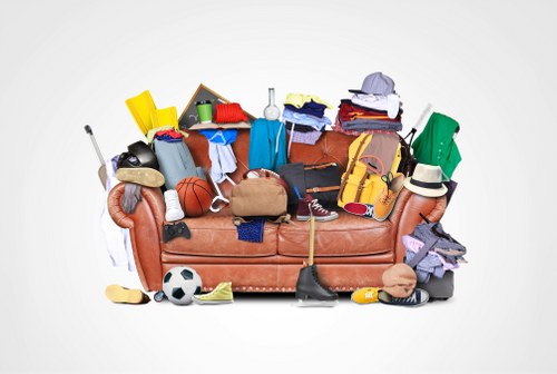 Flat clearance team removing furniture from a London apartment