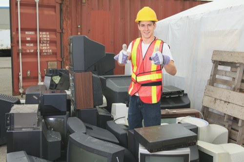 Clearance team loading construction waste from a London property