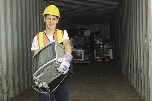 Professional rubbish removal team following safety procedures onsite
