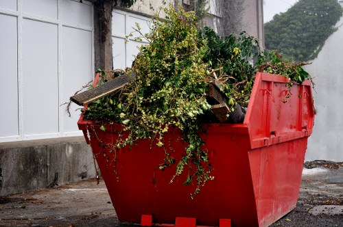 Professional waste removal service sorting mixed rubbish